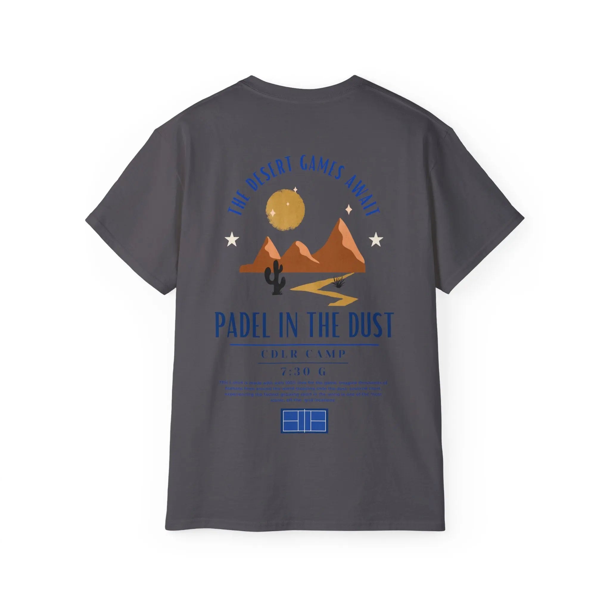 PSF Collective The Limited Edition - Padel in the Dust Tee by Printify features desert mountains, cactus, sun, stars, and a court graphic with "The Desert Games Await" text. Perfect for Patty Camps fans—your ultimate Burning Man padel shirt!. Designed for the Unwind