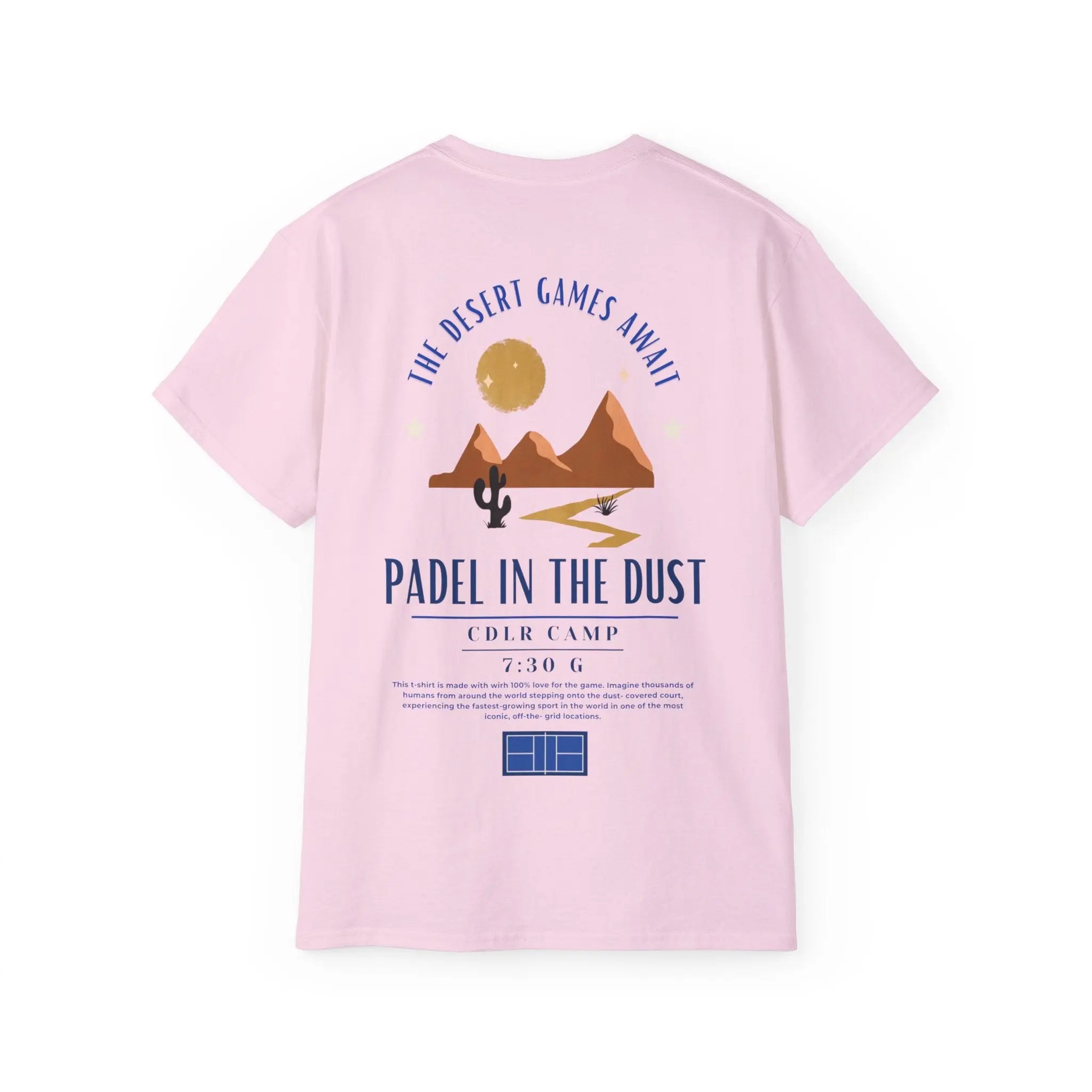 PSF Collective The Limited Edition - Padel in the Dust Tee by Printify features a light pink color, desert scene graphic with mountains, sun, cactus, "The Desert Games Await" text, Patty Camps info at 7:30 G, a paragraph, and a small blue court illustration. Designed for the Unwind