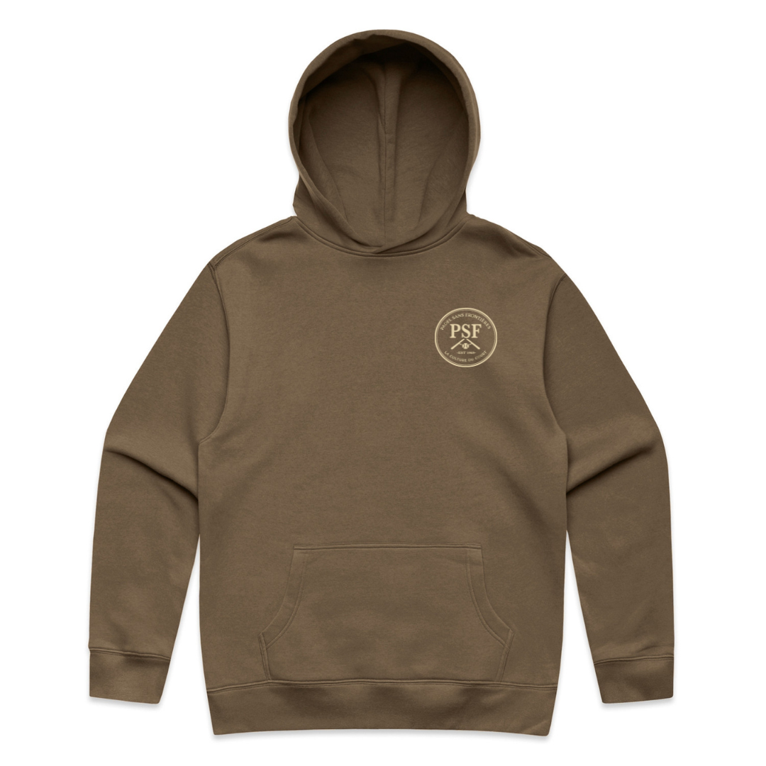 PSF Collective The King Palma Hoodie is a brown sustainable hoodie featuring a front pocket. On the left chest, it displays a small circular “PSF” logo with two crossed oars beneath it, all in light beige. The King Palma Hoodie is shown laid flat against a white background. Designed for the Unwind