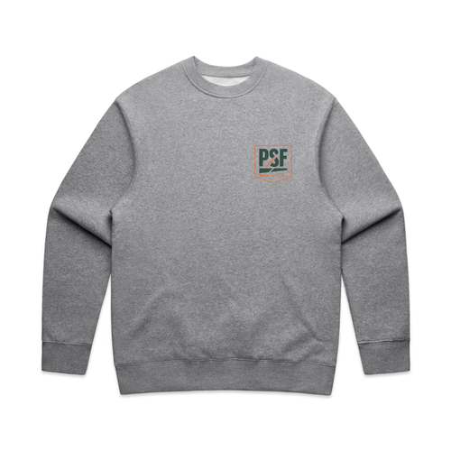 PSF Collective Court Culture by PSF Sweatshirt in gray, featuring a small green and orange PSCF logo with a fish and hook on the left chest. This unisex crewneck sweatshirt is displayed laid flat on a white background, highlighting its long sleeves along with ribbed cuffs and hem. Designed for the Unwind