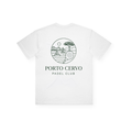 PSF Collective Porto Cervo Box Tee: A white T-shirt featuring an elegant back print of green line art in a Mediterranean style, illustrating a building, sailboats, a tree, a padel racket, and the sun. "PORTO CERVO PADEL CLUB" is printed below the artwork in green uppercase letters. Designed for the Unwind