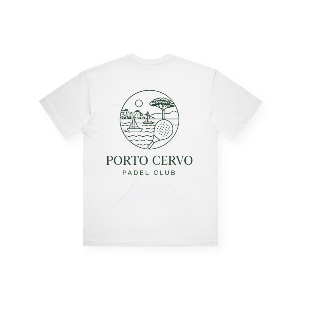 PSF Collective Porto Cervo Box Tee: A white T-shirt featuring an elegant back print of green line art in a Mediterranean style, illustrating a building, sailboats, a tree, a padel racket, and the sun. "PORTO CERVO PADEL CLUB" is printed below the artwork in green uppercase letters. Designed for the Unwind