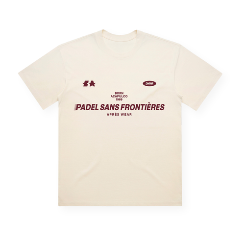 PSF Collective Introducing the Acapulco ’69 Box Tee: a cream-colored t-shirt featuring bold burgundy text reading “PADEL SANS FRONTIÈRES APRÈS WEAR” across the chest. Above the main print, you’ll find smaller logos and lettering, including a subtle reference to padel Acapulco 1969. Crafted as a premium quality tee, this shirt is displayed laid flat against a white background. Designed for the Unwind