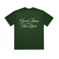 PSF Collective The Good Times and Tan Lines in Cream Box Tee, shown in dark green and displayed flat on a white background, features large, elegant cream-colored cursive lettering reading “Good Times and Tan Lines” across the shoulders and upper back—perfectly capturing the spirit of sun-soaked beach days. Designed for the Unwind