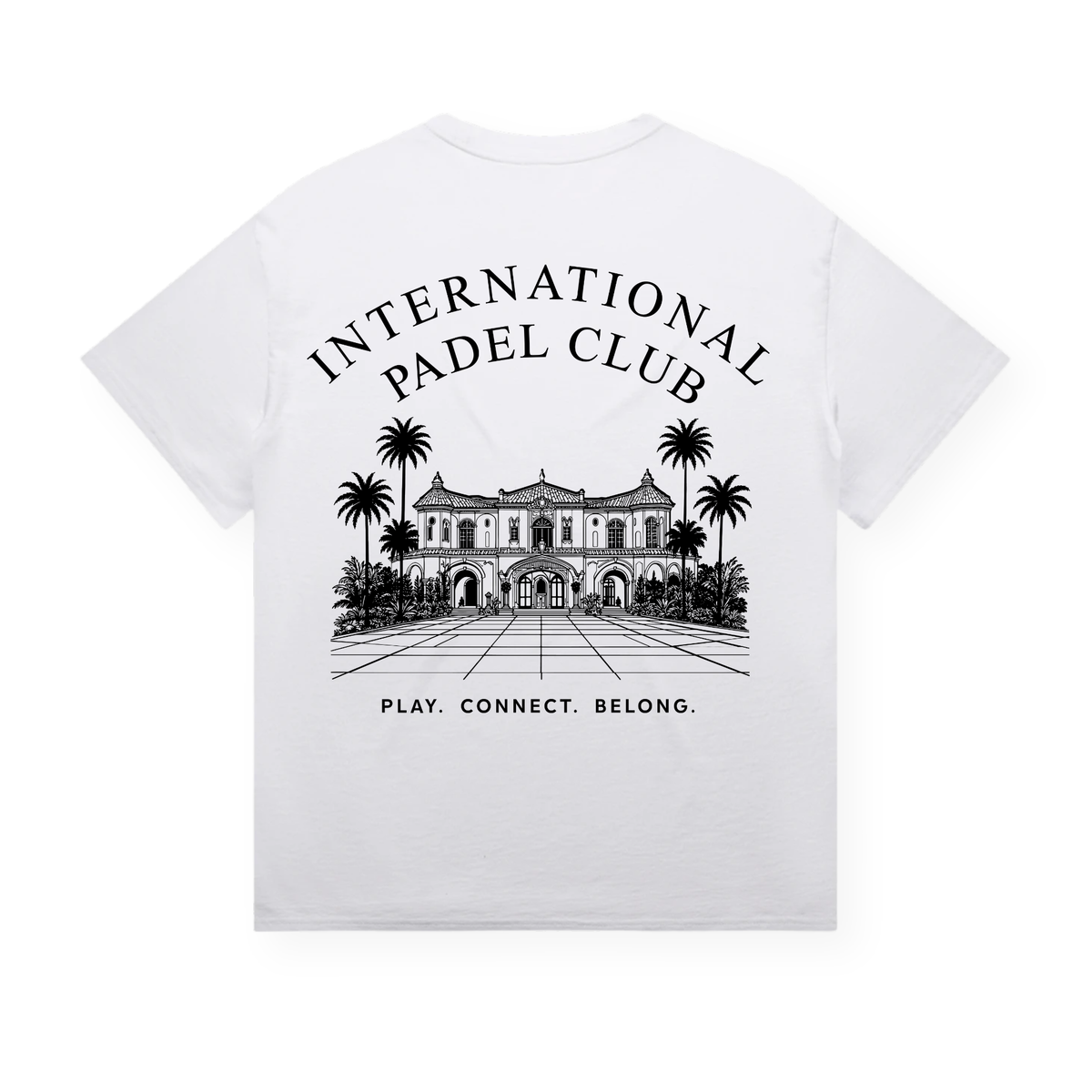 PSF Collective The Padel Clubhouse Box Tee 1 is a white cotton shirt featuring a black line art illustration of a grand building and palm trees centered on the back. Above the building, bold text reads INTERNATIONAL PADEL CLUB, while below are the words: PLAY. CONNECT. BELONG. This design highlights sustainable production and exclusive clubhouse style. Designed for the Unwind