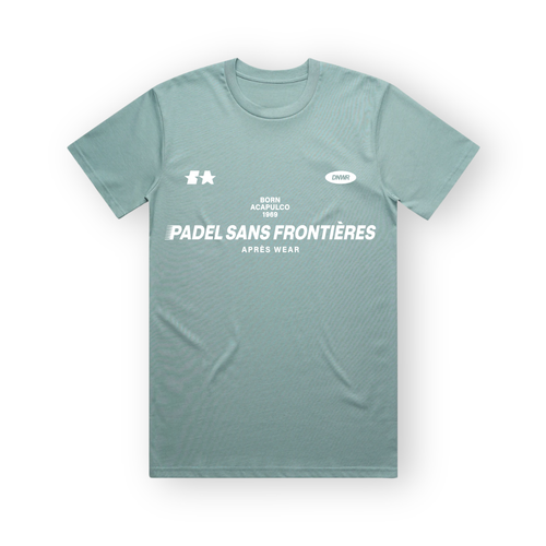 PSF Collective A sage green PSF-104 crew-neck padel t-shirt is laid flat against a white background, featuring white screen-printed text on the chest reading BORN ACAPULCO 1969, PADEL SANS FRONTIÈRES, and APRÈS WEAR, accented by small graphic icons at the top corners. Designed for the Unwind