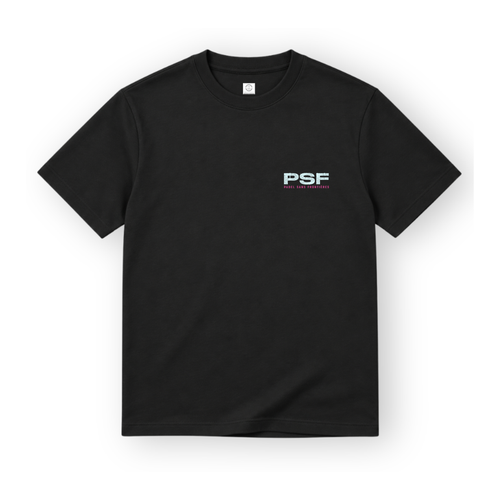 PSF Collective The PSF-123 is a black short-sleeved crew neck padel t-shirt shown against a white background, featuring the letters PSF printed in textured light blue on the left chest with PADEL SANS FRONTIÈRES in small pink letters beneath. Designed for the Unwind