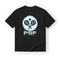 PSF Collective A black crew-neck PSF-123 padel wear t-shirt featuring a back graphic of two crossed rackets and a ball centered over a distressed, light blue circular paint splatter, with PSF and PADEL SANS FRONTIÈRES in pink text below. Designed for the Unwind