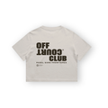 PSF Collective Back view of a beige PSF-129 cropped t-shirt for après-padel wear, featuring dark brown OFF COURT CLUB text with COURT printed upside down, followed by PADEL SANS FRONTIÈRES, a globe icon, and coordinates. Designed for the Unwind